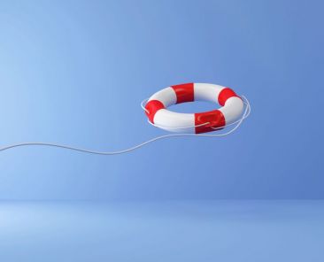 Red Lifebuoy with Rope on blue studio background