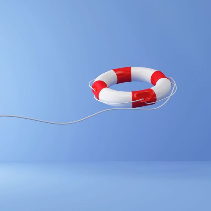 Red Lifebuoy with Rope on blue studio background